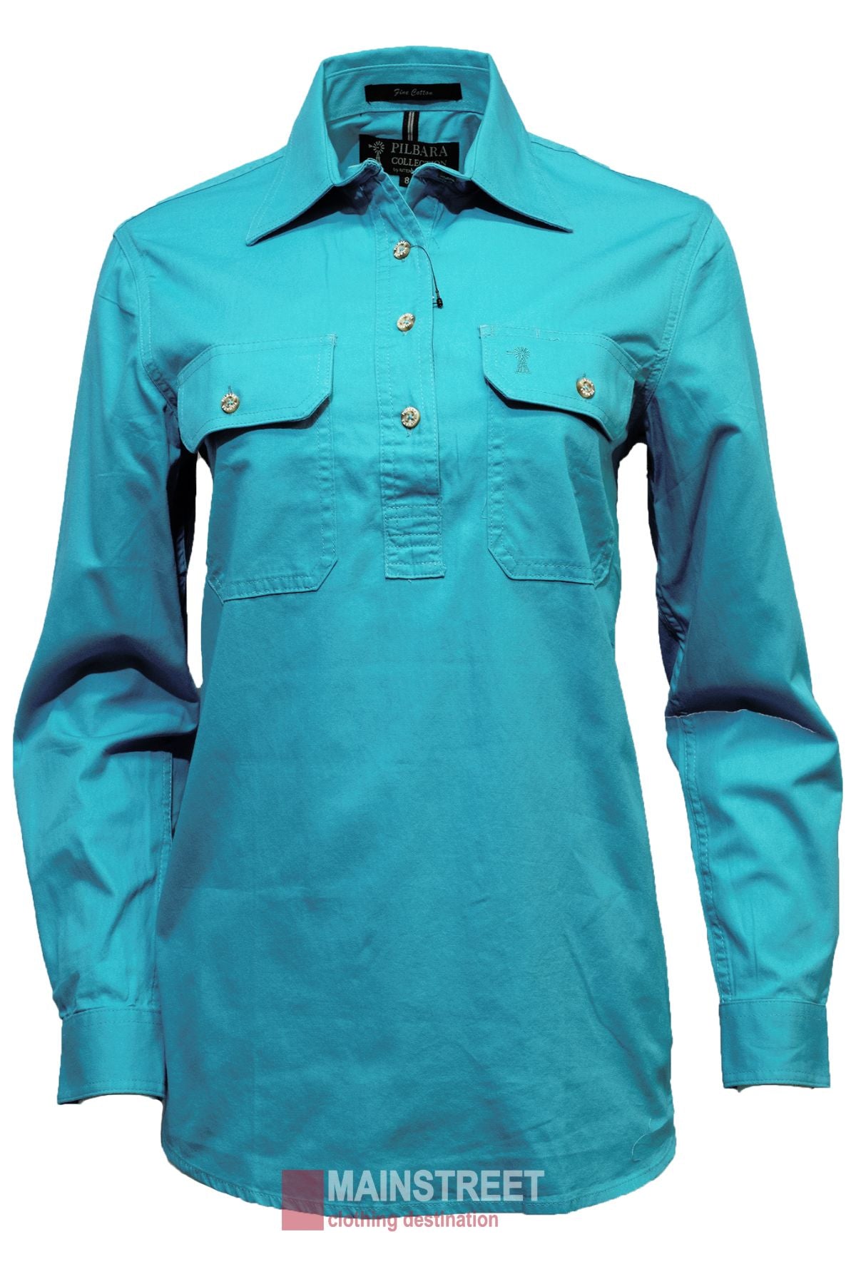 The Pilbara Ladies Long Sleeve Closed Front Shirt is a bright turquoise, 100% cotton women's work shirt with two button-flap chest pockets, a collar, and UPF 50+ rating. Displayed on white with the MAINSTREET clothing destination logo below.