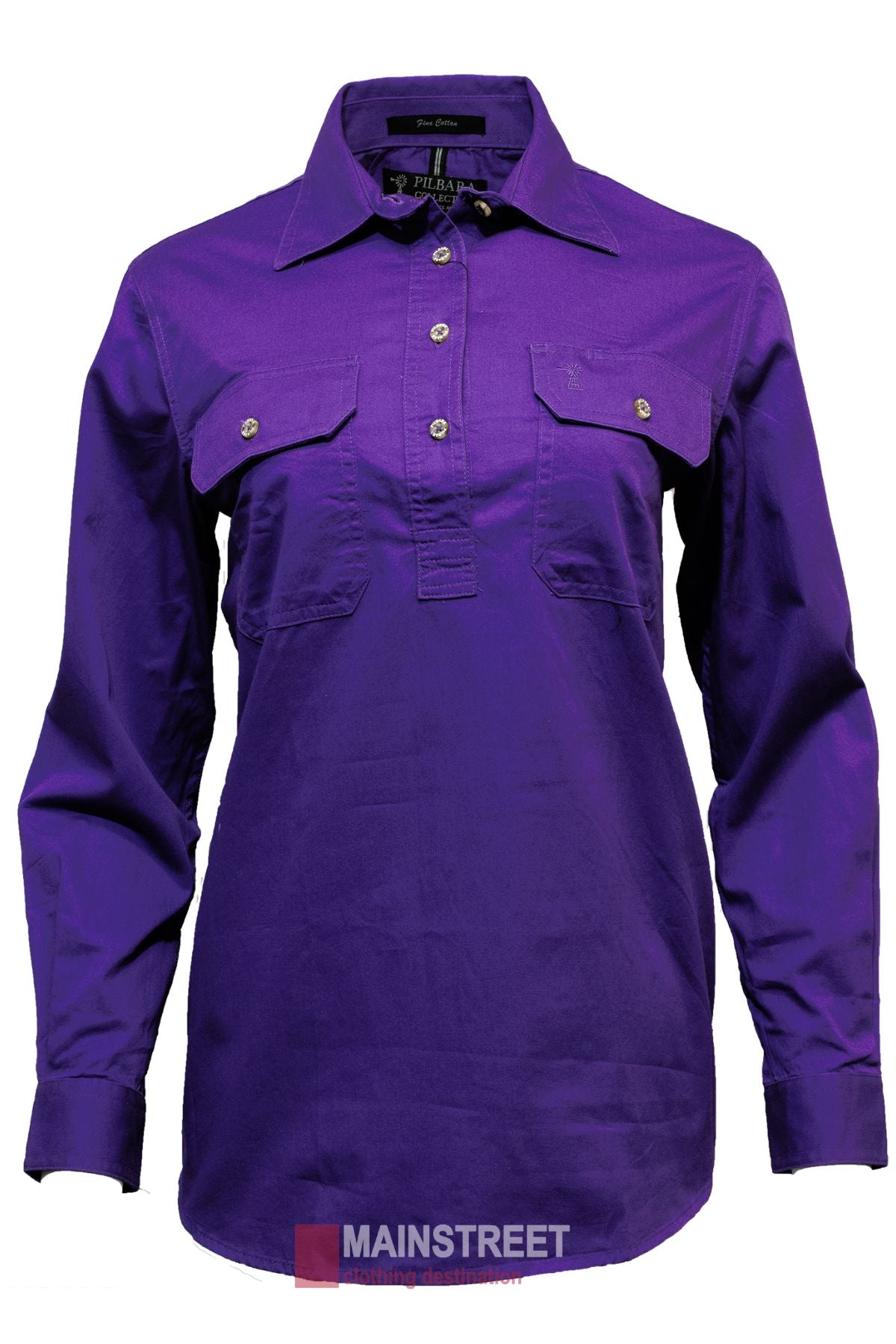 The Pilbara Ladies Long Sleeve Closed Front Shirt in purple features a collared, partial button-down design with two chest pockets with buttoned flaps. It's made from 100% cotton, has a smooth, slightly shiny finish, and offers UPF 50+ sun protection.