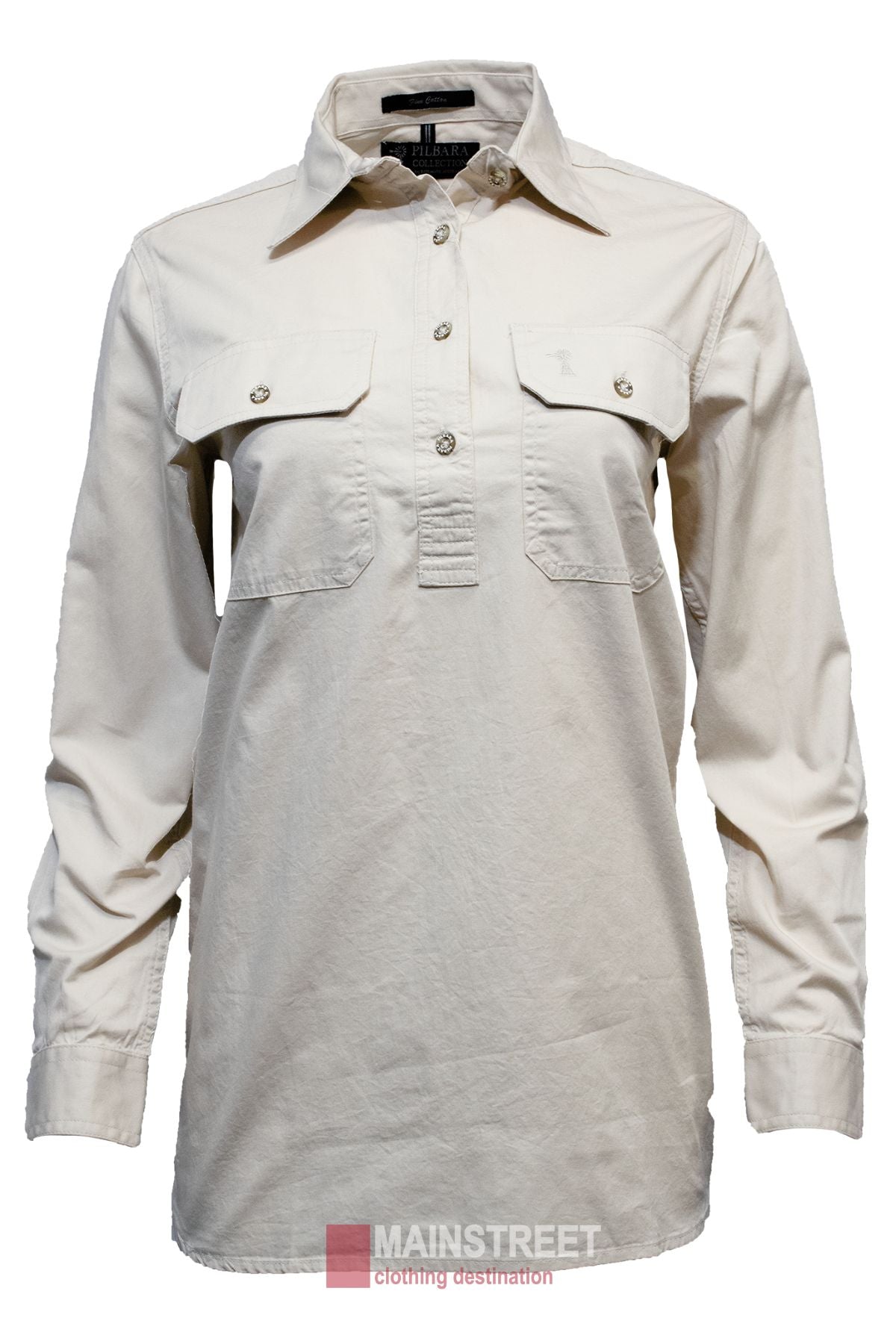 The Pilbara Ladies Long Sleeve Closed Front Shirt is a beige women's work shirt with UPF 50+, button-up front, two chest pockets, and a collar, shown on a white background with the Mainstreet Clothing Destination logo at the bottom.