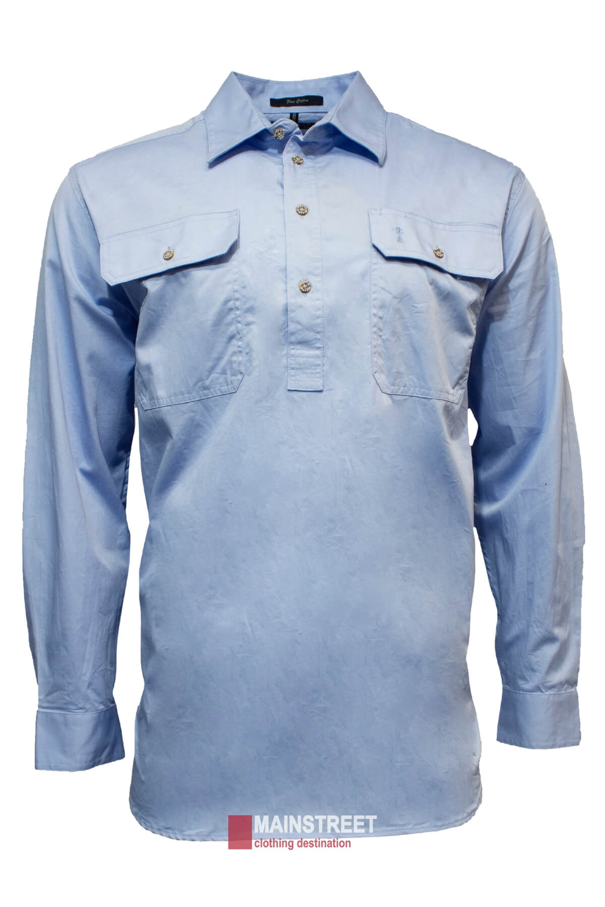 The Pilbara Long Sleeve Closed Front Shirt, a light blue men's work shirt with long sleeves and a UPF rating of 50+, features two chest pockets with buttoned flaps. This comfortable shirt is neatly displayed against a white background, with a "Mainstreet clothing destination" watermark at the bottom.