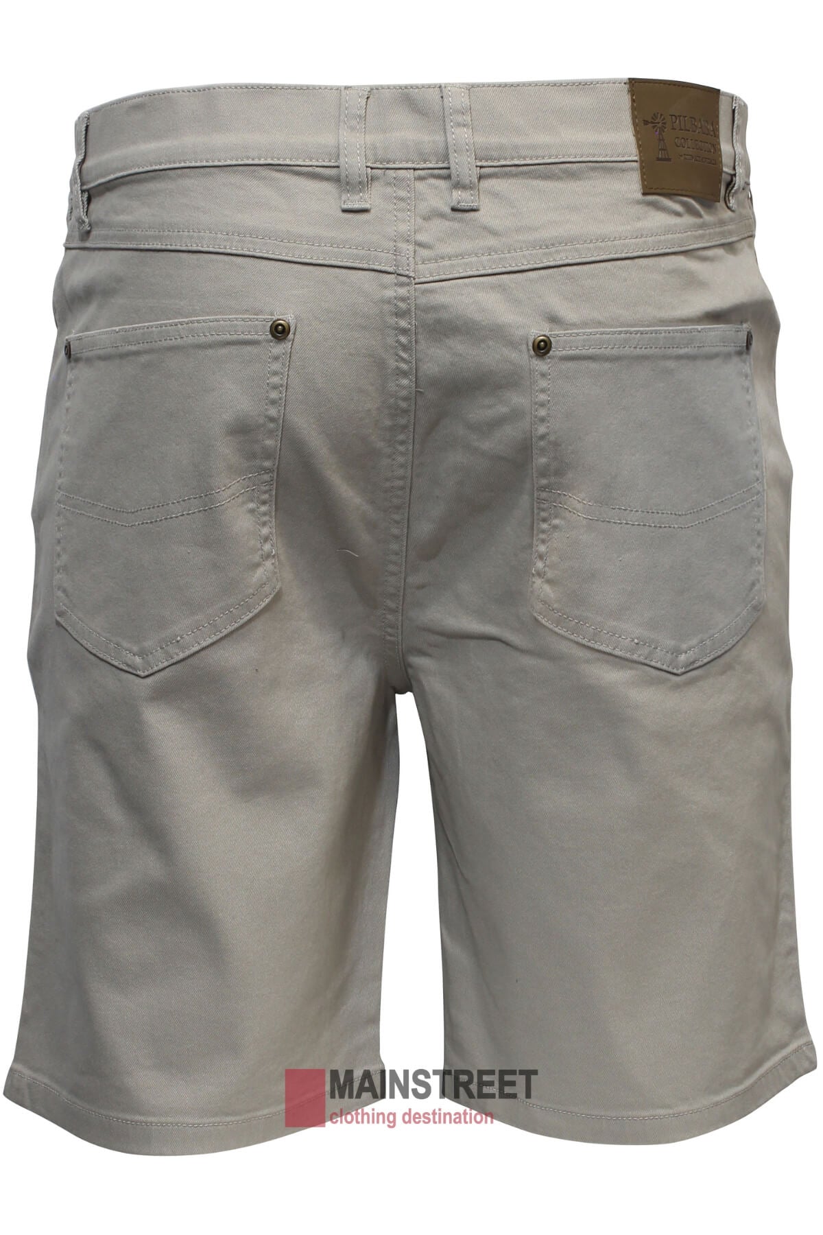 A rear view of the Pilbara Cotton Stretch Jean Short in classic fit beige showcases two back pockets, each secured with metallic rivets at the top corners. The waistband features a brown leather brand patch. They are displayed against a plain background with "MAINSTREET" partially visible at the bottom.
