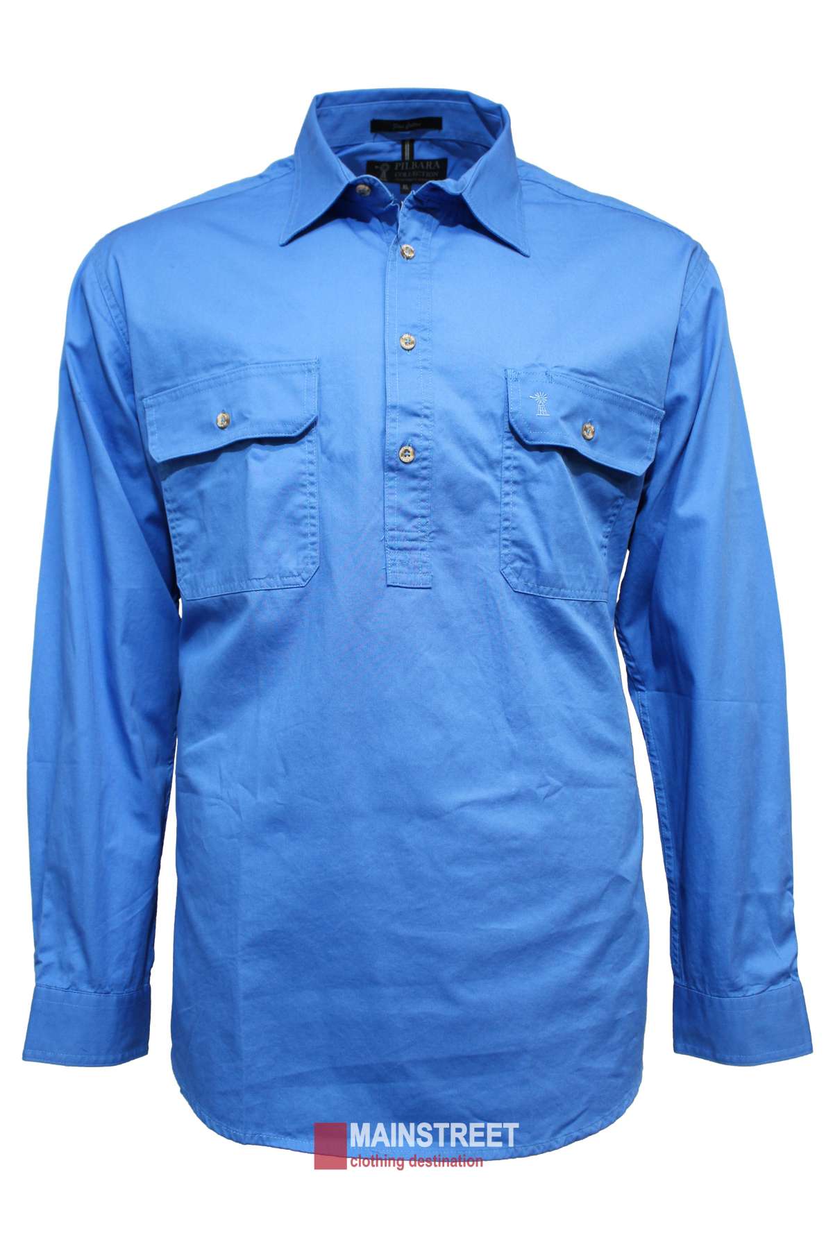 A Pilbara Heavy Weight Long Sleeve Closed Front Shirt for men in blue, featuring two chest pockets and UPF 50+ protection, is displayed on a white background. The label "MAINSTREET clothing destination" appears at the bottom.