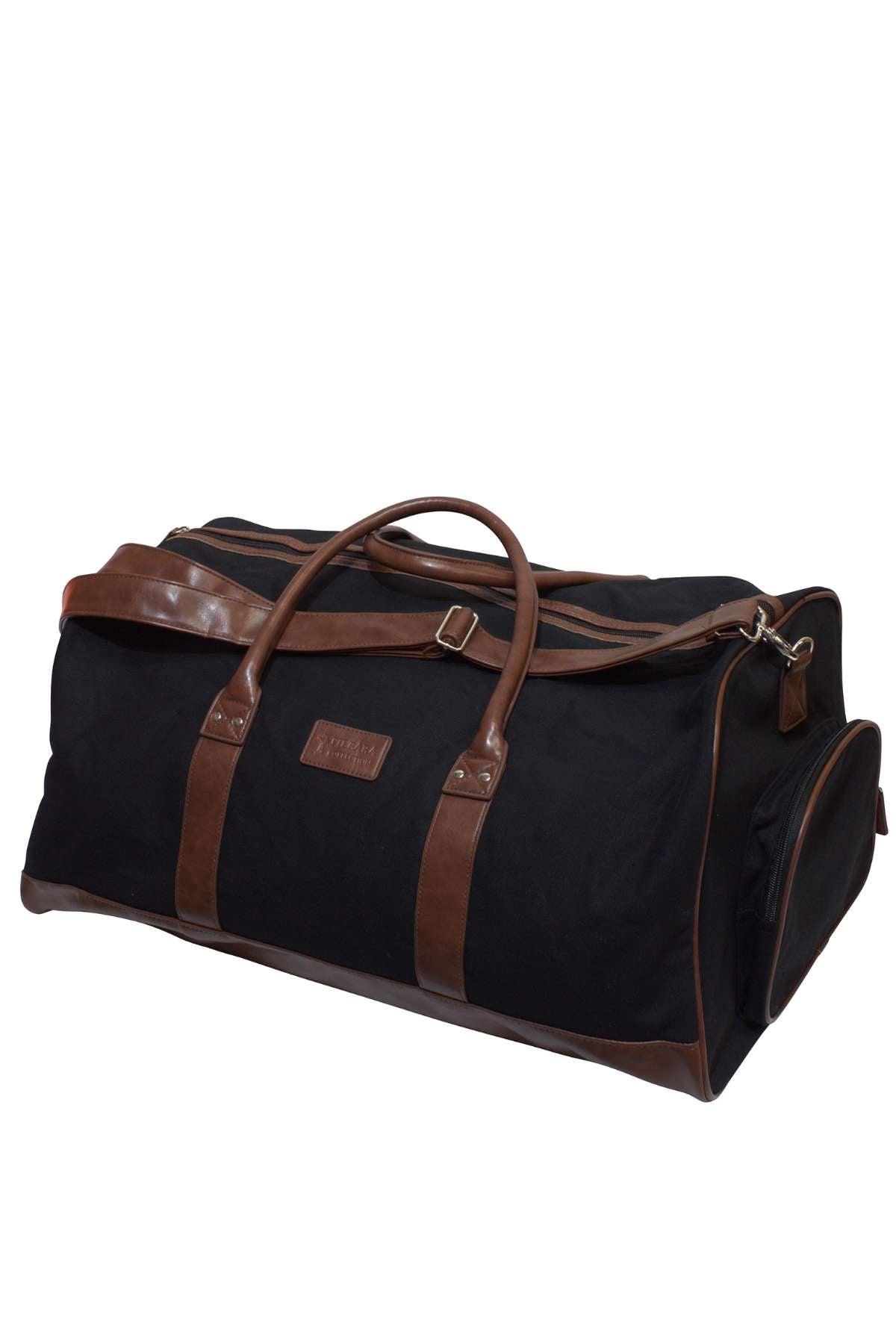 The Pilbara Long Weekender Bag is a spacious black duffel featuring brown leather straps and accents. Crafted from the finest quality canvas and leather, this rectangular-shaped bag includes a zippered main compartment, side pockets, handles, and a detachable shoulder strap, perfect for weekend getaways.