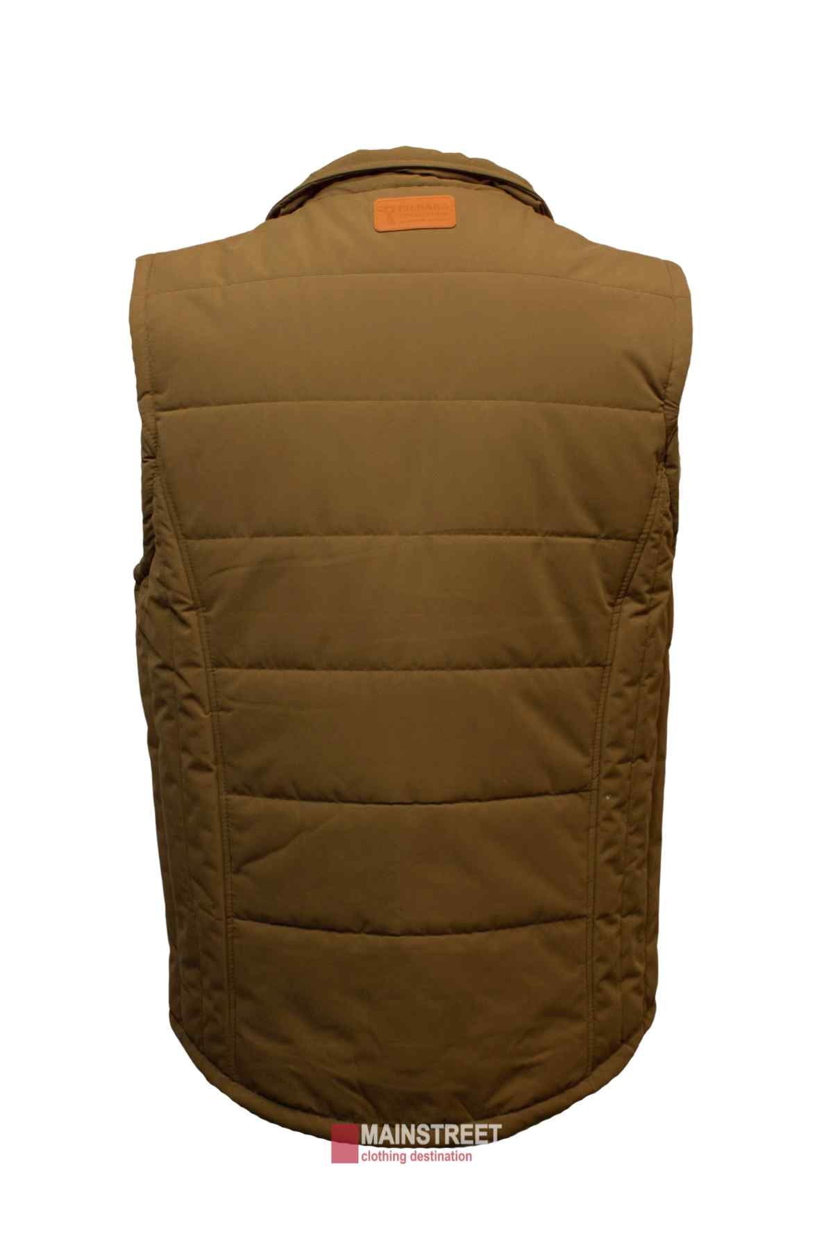 The Pilbara Vest is displayed from the back, showcasing its quilted pattern and stitching details. Featuring polyfill padding, the sleeveless brown vest has a high collar and a small leather tag near it. Below the vest, the text "Mainstreet clothing destination" is visible.