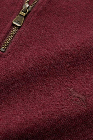 Close-up of the Rodd & Gunn Alton Ave Sweat, a maroon 100% cotton sweater featuring a brass zipper and a subtle embroidered pouncing animal logo in the lower right corner.