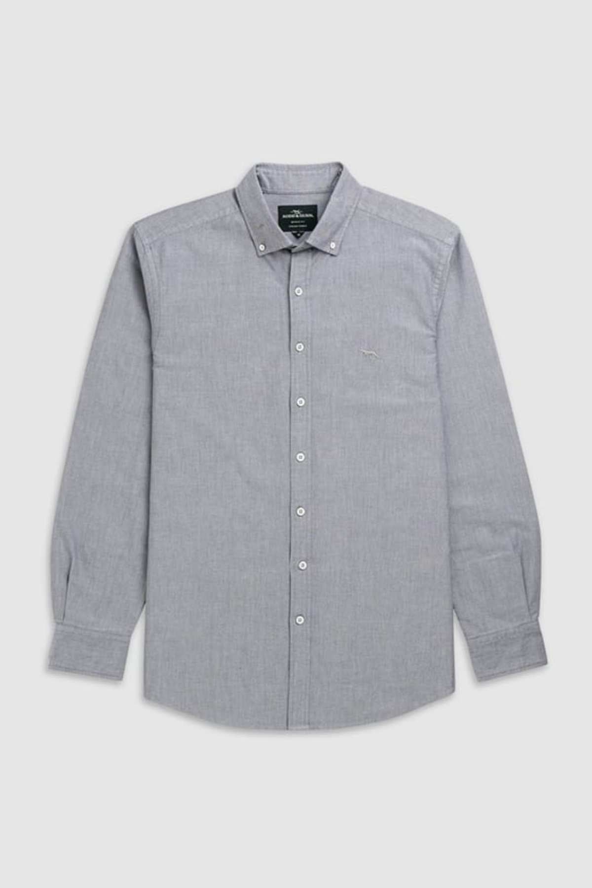 The Rodd & Gunn Gunn Oxford Sports Fit Shirt, a stylish long-sleeved button-down in light gray, is displayed neatly folded against a white background. Made from 100% cotton, it features a classic collar with buttons and a small logo on the left chest area.