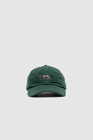 The Rodd & Gunn Signature Cap is a green baseball cap made of heavy-duty cotton twill, featuring an embroidered snow leopard on the front. It includes a curved brim and adjustable strap, set against a plain gray background.