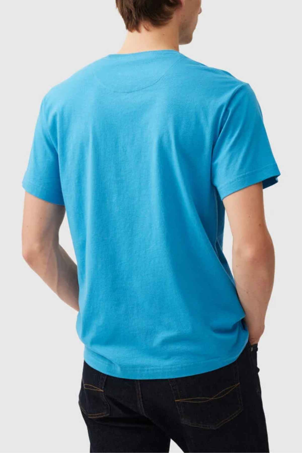 Someone is shown from the back wearing the Rodd & Gunn The Gunn T-Shirt in bright blue Australian cotton with dark jeans, standing against a plain light background.