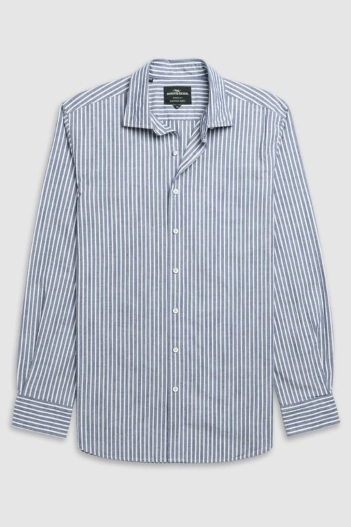 The Rodd & Gunn Fernside Sports Fit Shirt is a long-sleeve button-up with blue and white vertical stripes, made from premium European cotton. It features a classic collar, white buttons, and is shown laid flat on a light gray background.
