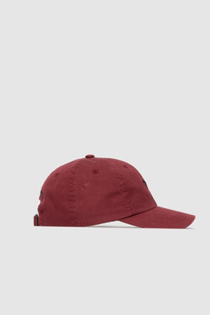A maroon Rodd & Gunn Gunn Cap with the signature pointer dog logo is shown from the side on a plain light gray background.