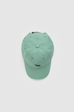 A light teal Rodd & Gunn Gunn Cap, featuring a curved brim and a small black embroidered logo on the front, is photographed from above on a plain light gray background.