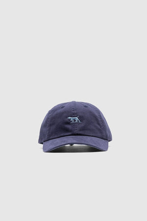 The Rodd & Gunn Gunn Cap is a navy blue cotton twill cap featuring a small light blue embroidered dog logo on the front, displayed against a plain light gray background—ideal for casual, comfortable style.