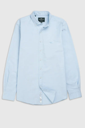 The Rodd & Gunn Gunn Oxford Sports Fit Shirt is a light blue men’s cotton shirt with long sleeves, a collar, and a subtle embroidered chest logo, displayed flat against a plain background.