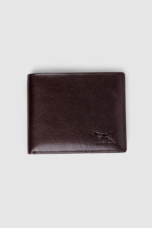 The Rodd & Gunn Wakefield Bi-Fold Wallet, crafted from dark brown Italian leather with a discreet embossed animal logo at the bottom right, is shown against a plain light gray background.