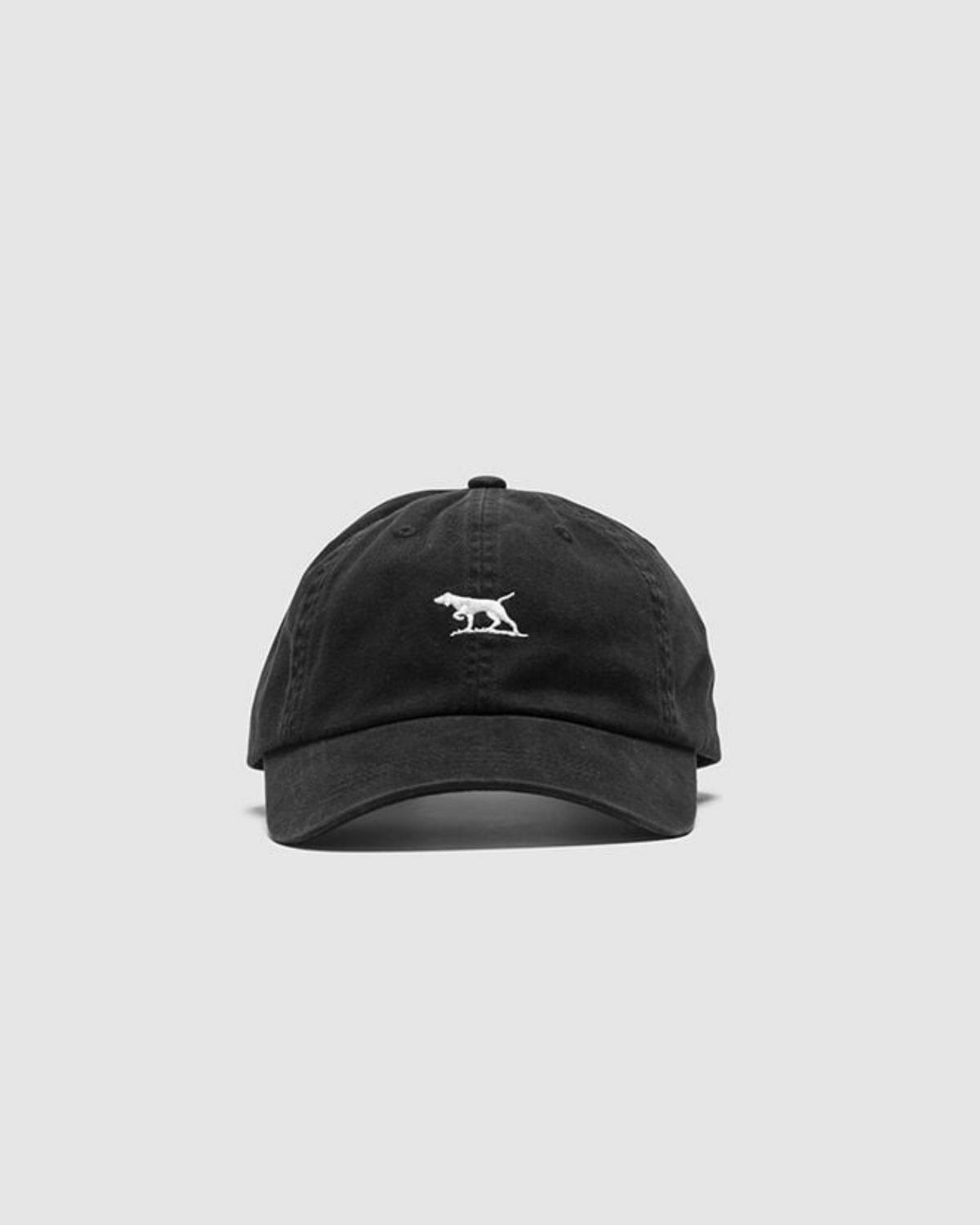 The Rodd & Gunn Gunn Cap, made from heavy-duty cotton twill, sports a black design with a white embroidered two-dog logo on the front. It includes an adjustable strap for a comfortable fit and is showcased on a plain light gray background.
