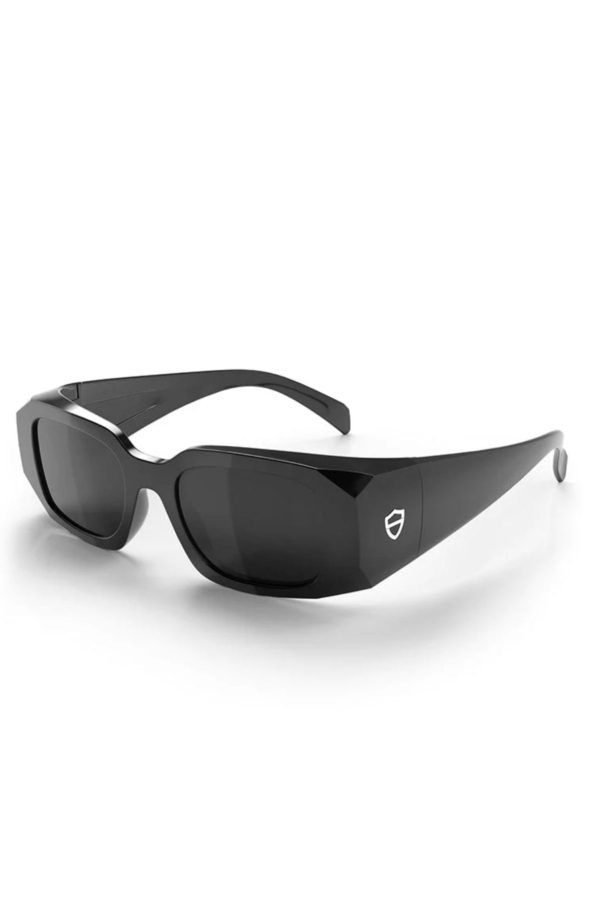 The SafeStyle Auras feature a black frame, grey polarised lenses, and a small shield logo on thick arms, providing stylish eye protection. Displayed on a white background.