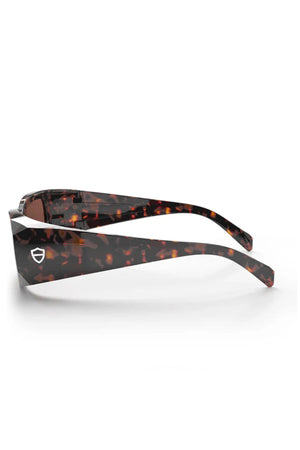 Side view of SafeStyle Auras sunglasses featuring thick, brown tortoiseshell frames and brown polarised lenses. The temple arm displays a small silver shield logo for added style and full UV400 protection.