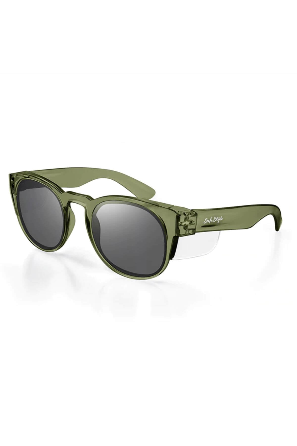 The SafeStyle Cruisers feature a modern, sleek design with green polycarbonate frames, dark polarized lenses for UV protection, a glossy finish, and a white brand logo on the temple. Their slightly rounded shape ensures durability and style.