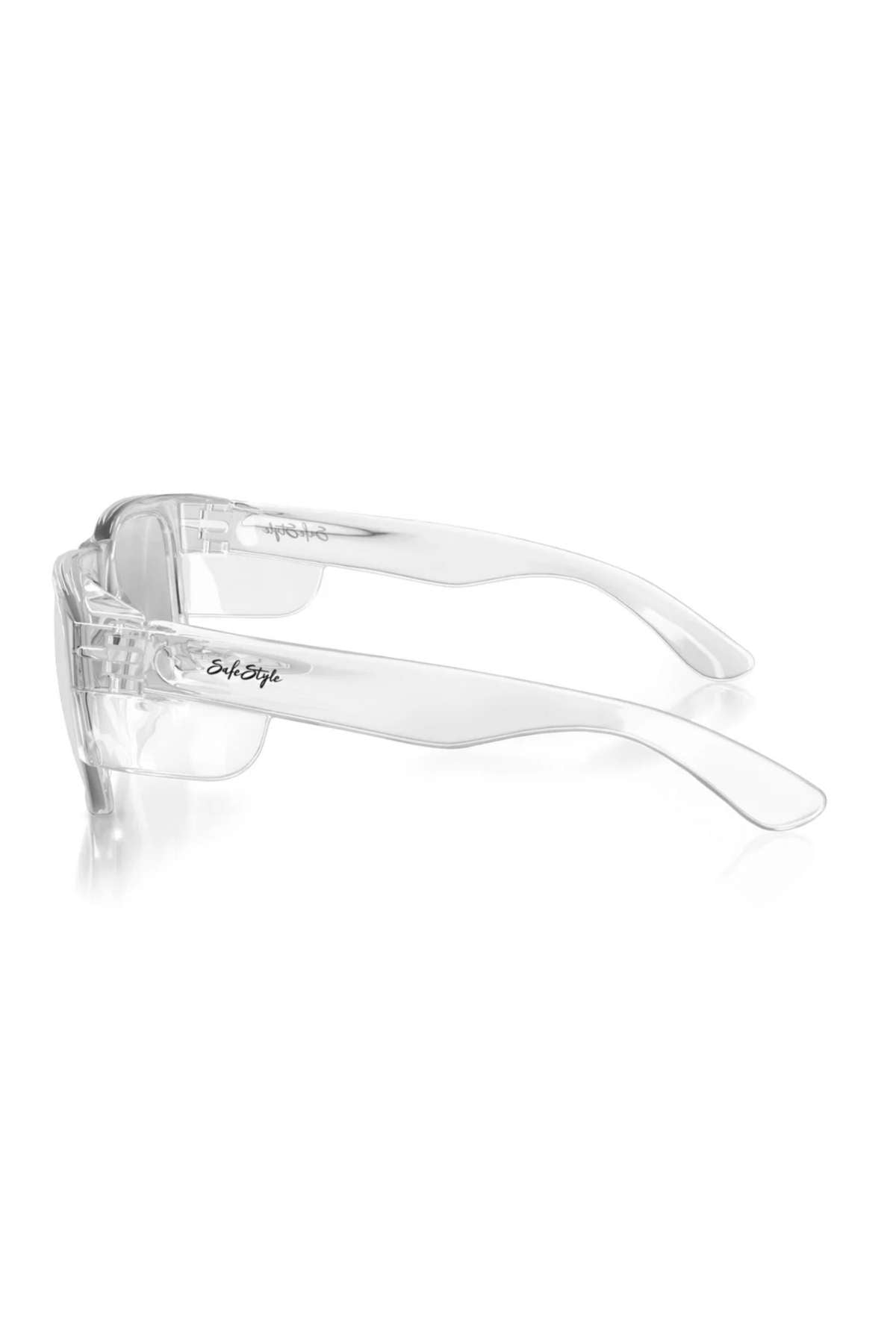 SafeStyle Fusions Clear Frame Hybrids feature shatterproof polycarbonate lenses and wide, transparent arms. The curved design ensures full coverage and UV protection. The glasses display a subtle logo on the arm and are shown on a white background.