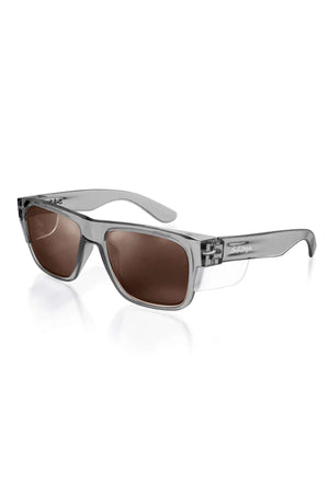SafeStyle Fusions sunglasses feature graphite frames with brown polarized lenses and UV protection. The rectangular design includes transparent accents and a subtle brand logo on the arms for added style.