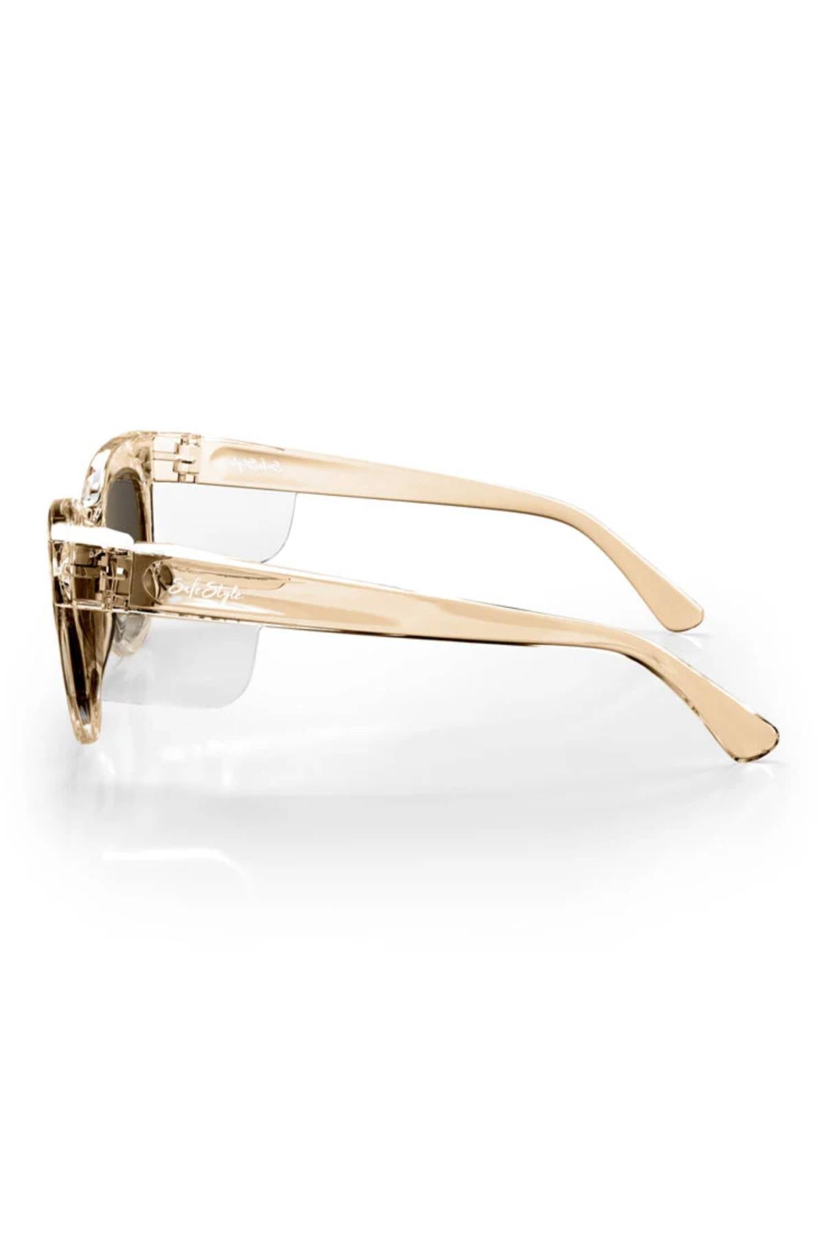 Side view of SafeStyle Harps sunglasses featuring UV protection, transparent beige frames, and dark polarized lenses. The visible temples and hinges highlight a sleek modern design, all set against a white background.