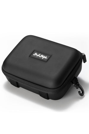 The Safestyle Double Hardcase is a black, rectangular EVA storage case for safety glasses with a zipper, side clip, and top patch displaying the Script logo. It's shown resting on a white surface.
