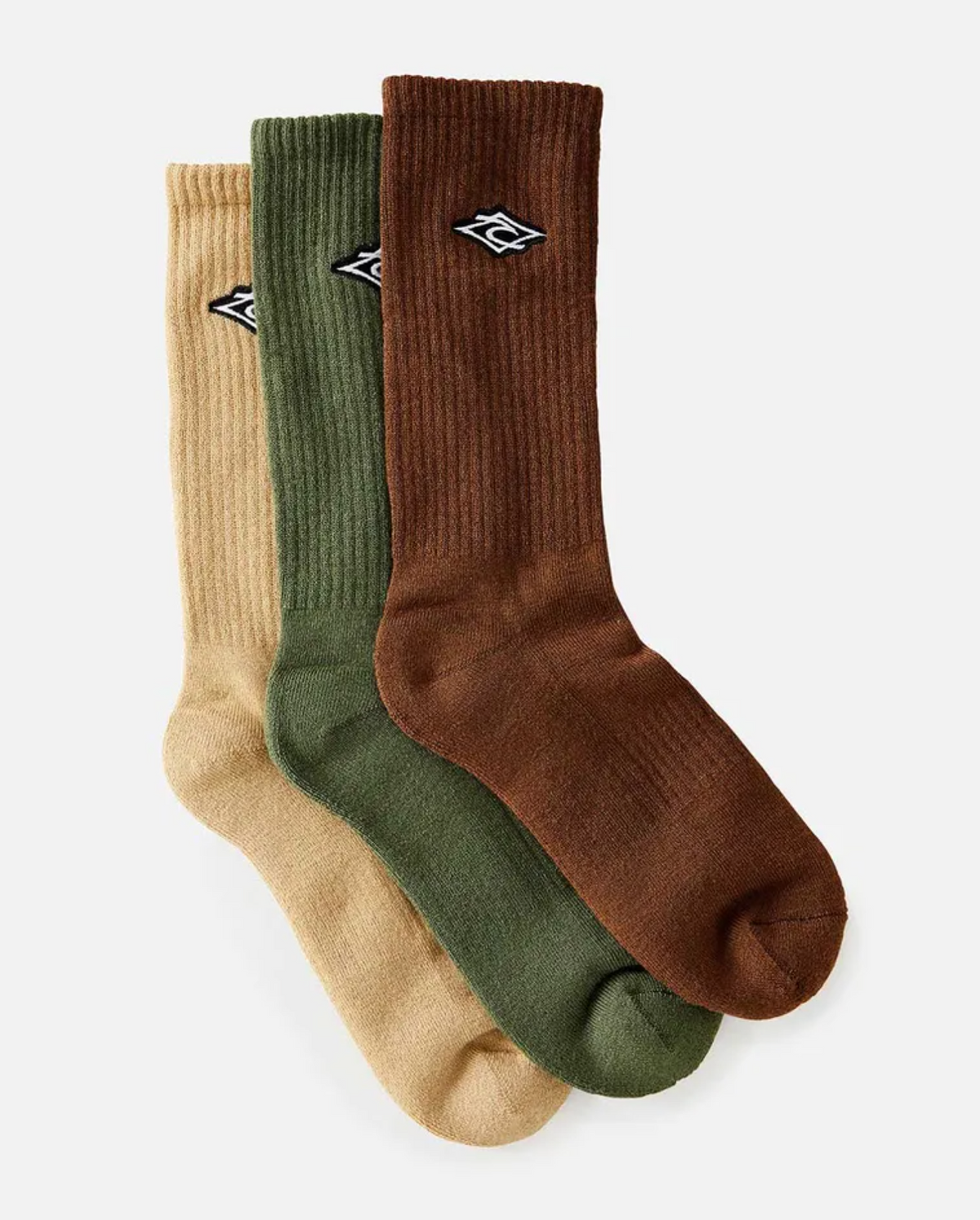 The Rip Curl Diamond Crew Sock 3 Pack in beige, green, and brown features a small black and white emblem with arch support for comfort. Set against a plain white background, these socks blend style with functionality.