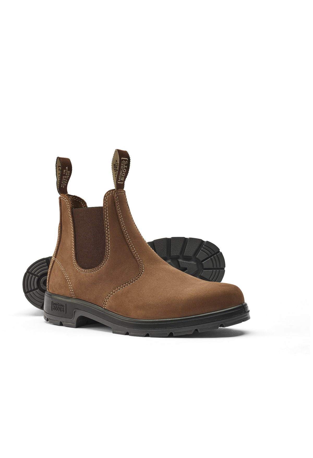 The Mongrel K9 Elastic Sided Boot K91070 in brown leather features elastic side panels, front and back pull tabs, and a black oil and fat resistant sole. Displayed at an angle, one boot stands upright while the other lies on its side.