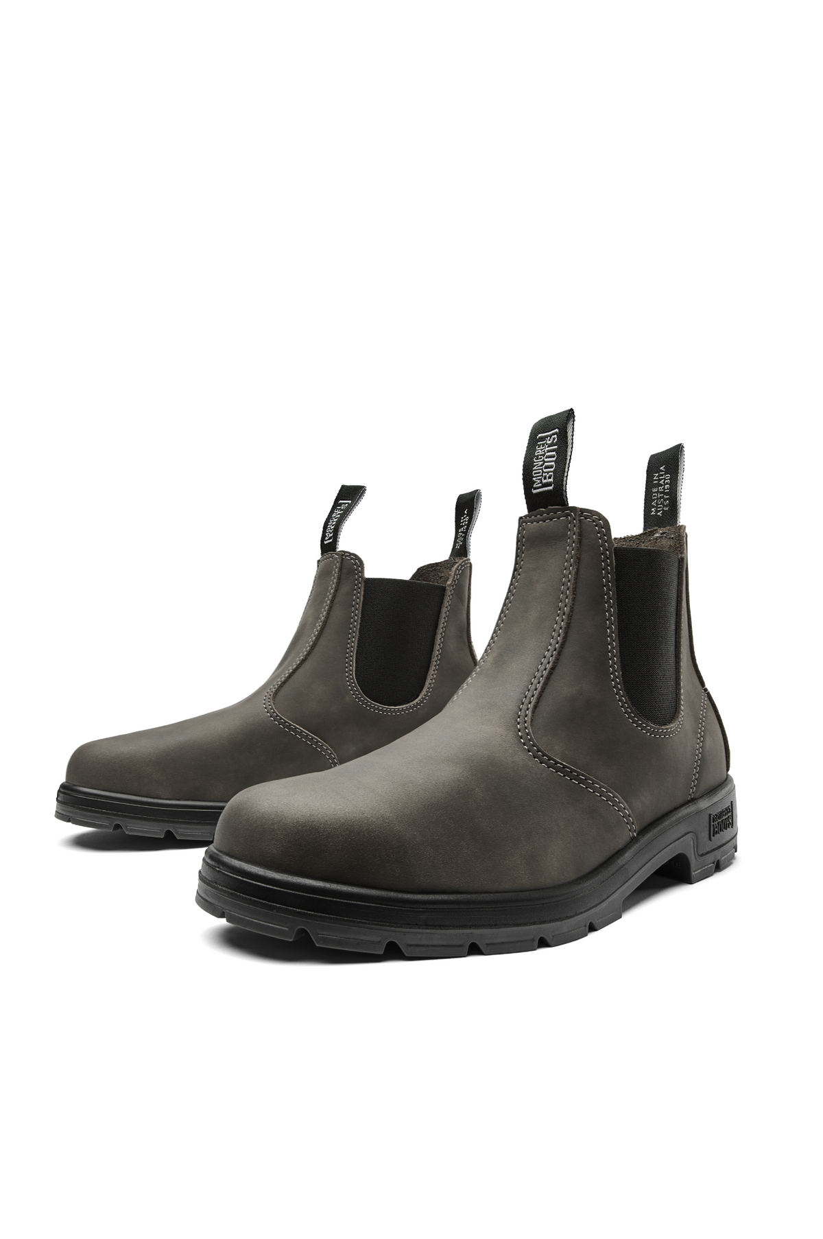 The Mongrel K9 Elastic Sided Boot K91085 is a pair of dark brown Chelsea boots made from premium leather, featuring elastic side panels and back pull tabs. They have a rugged matte finish, black rubber soles, and an Orthotec Lite footbed for enhanced comfort.