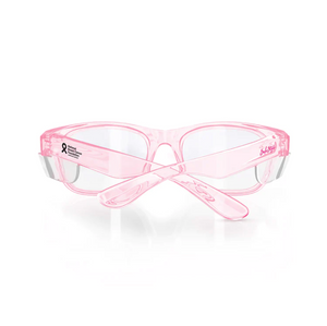 The SafeStyle Classics Pink Frame Clear Lens features UV400 protection, clear lenses, and a semi-transparent pink frame with a breast cancer awareness ribbon and logo. Stylish crossed arms at the back complete this safety-rated design.
