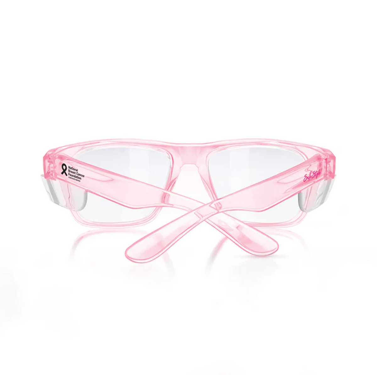 SafeStyle Fusions Pink Frame Clear Lens glasses have a stylish pink frame, clear lenses, and crossed arms. A black ribbon adorns the right side. Featuring UV400 protection, they offer excellent safety against harmful rays, all set against a white background.