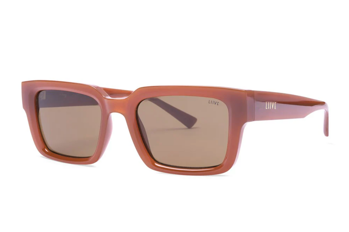 Liive Oney Sunglasses feature rectangular brown polycarbonate frames with dark lenses and "LIIVE" branded temples. This modern, stylish design provides reliable UV protection for your eyes.