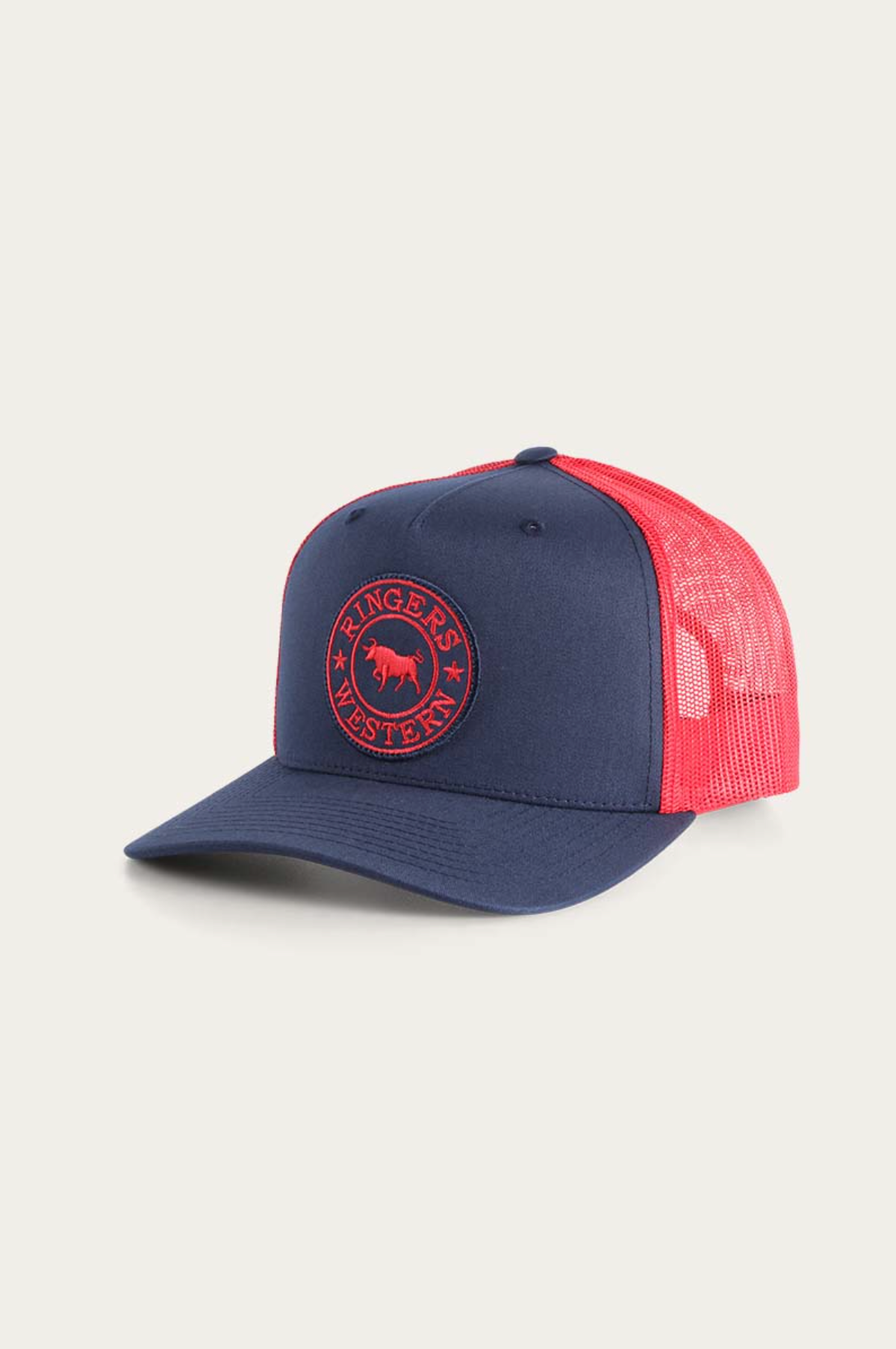 The Ringers Western Signature Bull Trucker Cap is a stylish blue and red cap with a mesh back, durable cotton twill front, and features a circular patch of a horse with "Ringers Western" in bold red on the navy front panel.