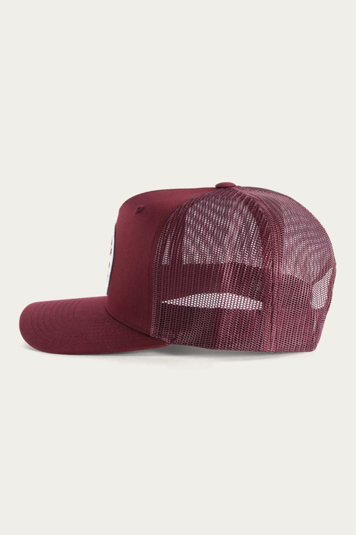 Side view of the maroon Ringers Western Signature Bull Trucker Cap featuring a solid cotton twill front, mesh back, curved brim, and adjustable strap.