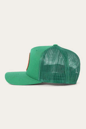 The Ringers Western Signature Bull Trucker Cap, made from cotton twill, flaunts a solid front with a mesh back and features an orange patch. With a curved brim and adjustable strap, this green hat combines style and comfort.