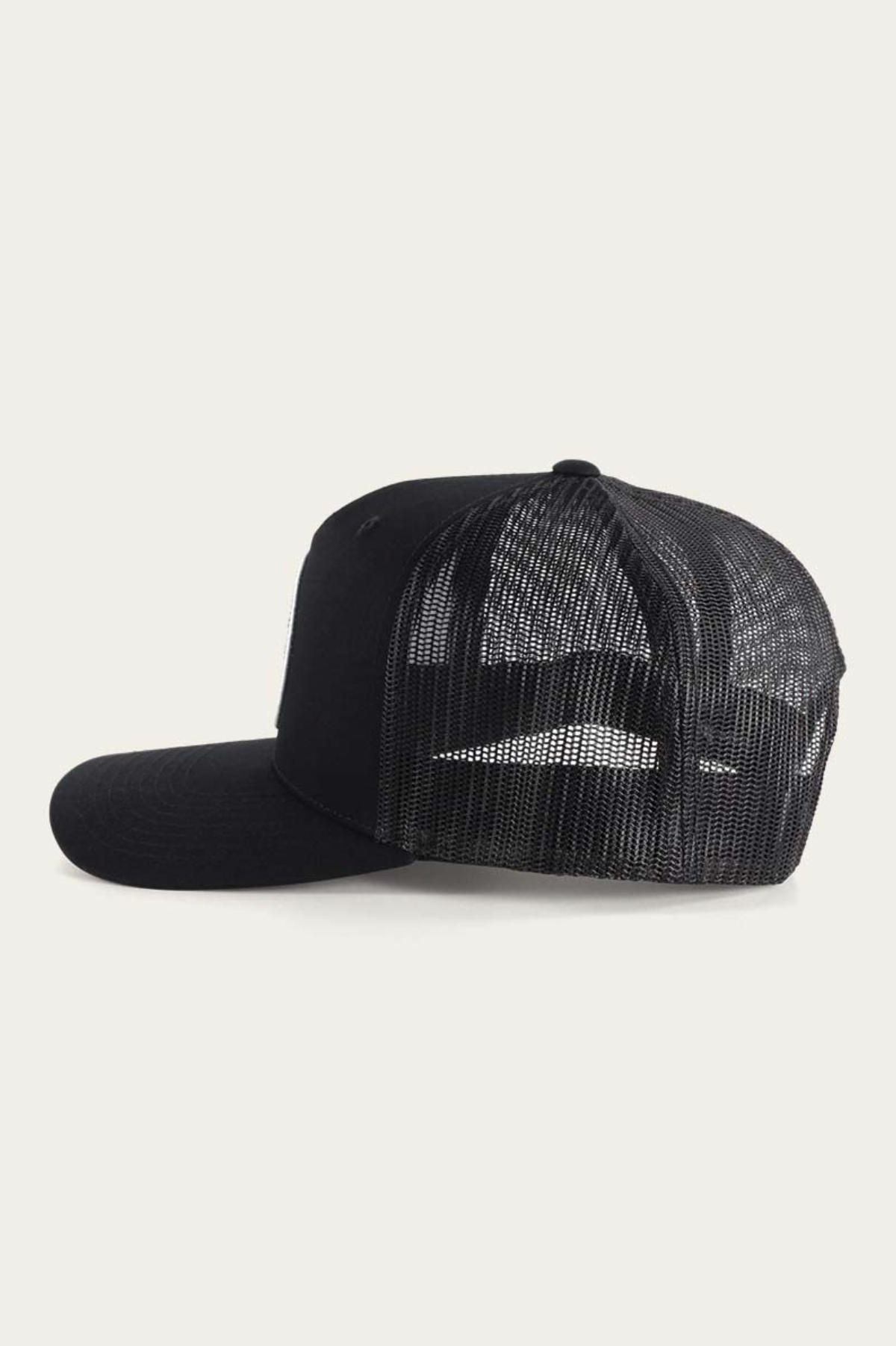The Ringers Western Signature Bull Trucker Cap is black with an adjustable strap for a perfect fit, featuring a solid front and breathable mesh back, set against a plain white background.