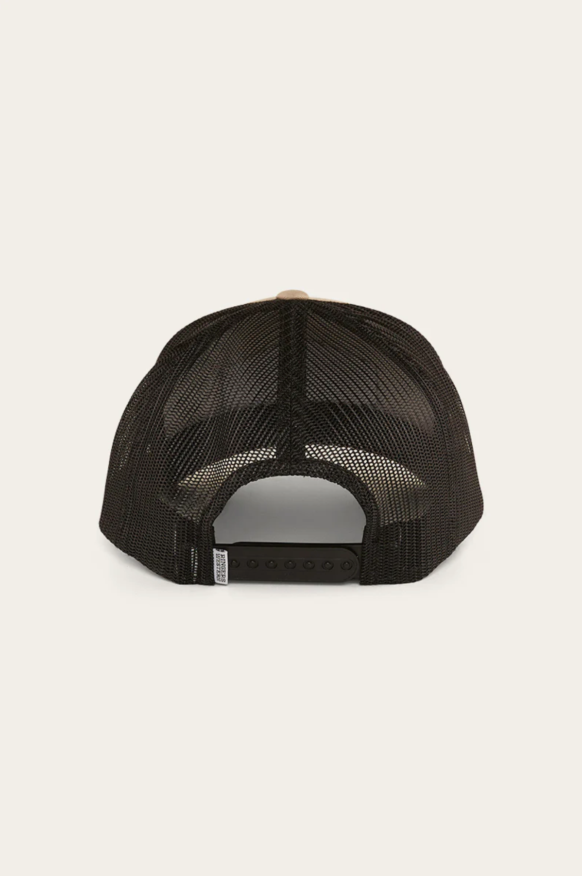 The black Ringers Western Scotty Trucker Cap is shown from the back, featuring an adjustable snapback closure and curved bill. Its semi-transparent mesh reveals interior structure, reflecting its Ringers Western heritage.
