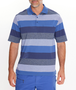 A man in a Breakaway Neon Kinnersly Polo with a rib knit collar, chest pocket, and blue striped design, paired with blue shorts, stands against a white background. His face is partially visible.