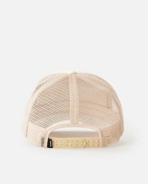 The Rip Curl Premium Surf Trucker, a beige cotton mesh-back baseball cap, is shown back-facing forward with an adjustable plastic snap strap. It has a side tag and is set against a plain white background.