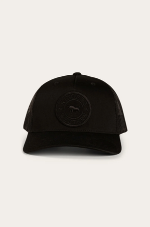 The Ringers Western Signature Bull Trucker Cap is black with a curved brim, cotton twill front, mesh back, and a circular embroidered bull patch with "Ringers Western" on the front.