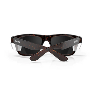 A pair of SafeStyle Fusions Brown Tort Frame Polarised Lens sunglasses, seen from the back with crossed arms. The brand name is printed in white on the arms.
