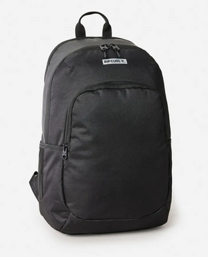 The Rip Curl Ozone Icons 30L Backpack is crafted from recycled polyester and includes a front pocket, main zippered compartment, and essential organizer. Featuring a top handle, it’s ideal for daily use and eco-conscious adventurers.