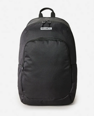 The Rip Curl Ozone Icons 30L Backpack in black, made from recycled polyester, includes organizer pockets, a front pocket, side pockets, and a main compartment. It features the logo prominently near the top and is styled against a white background for a blend of sustainability and functionality.
