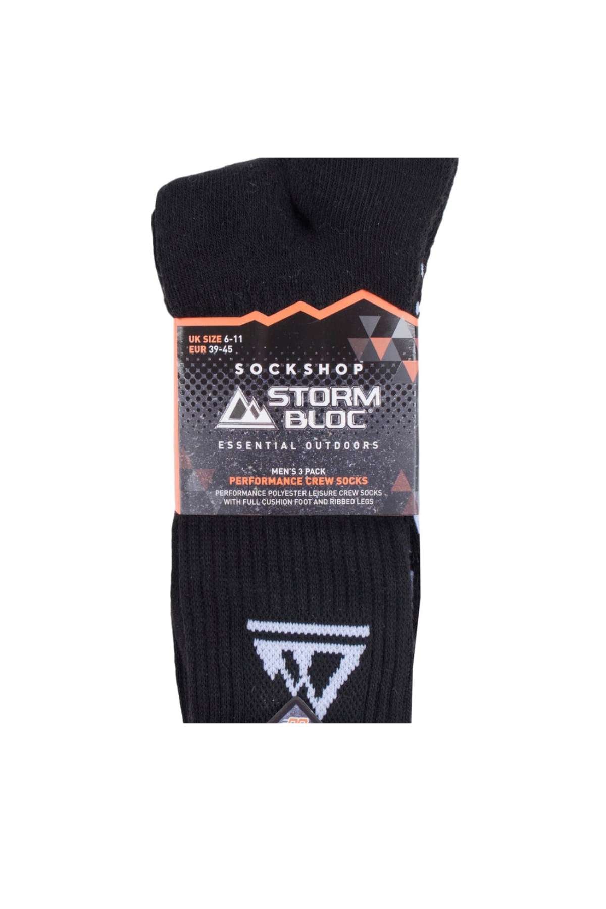 A folded pair of black socks featuring a geometric logo, packaged with a label indicating "SockShop Storm Bloc 3 Pack Crew Cushion Sock" along with size information. These Crew Cushion Socks have a heavily cushioned sole that emphasizes their thermal and moisture-wicking capabilities—ideal for outdoor activities.