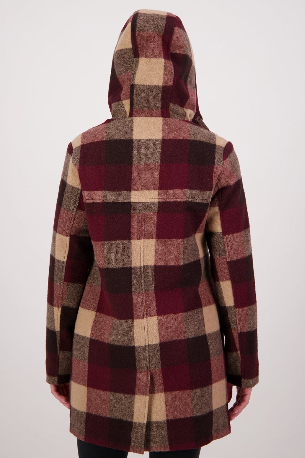 A person wearing the Swanndri Annmore V2 Wool Overcoat, featuring a large plaid pattern in burgundy, beige, and brown shades with a hood, is shown from the back against a plain light background.
