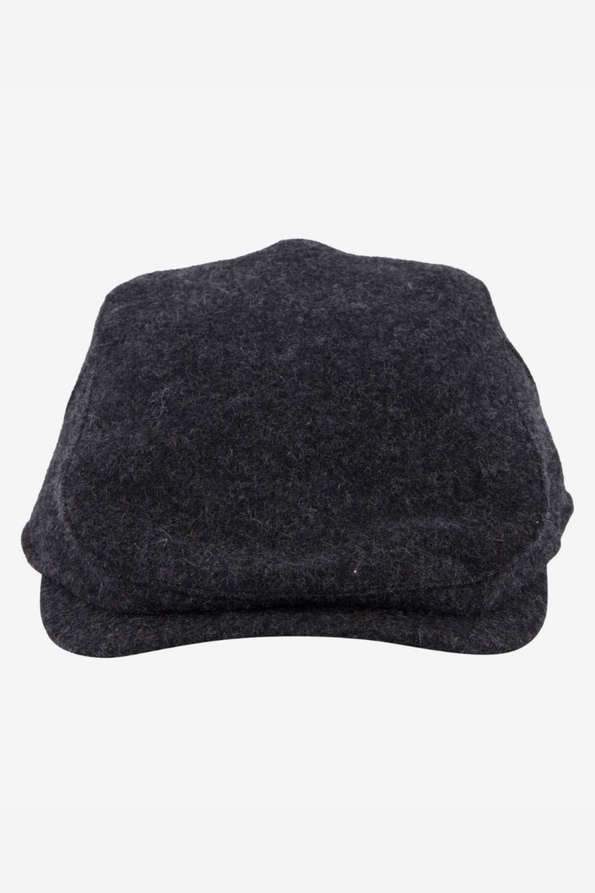 A trio of Swanndri Bristol Flat Caps in dark grey, ideal for outdoor adventures, is stylishly stacked against a white backdrop.