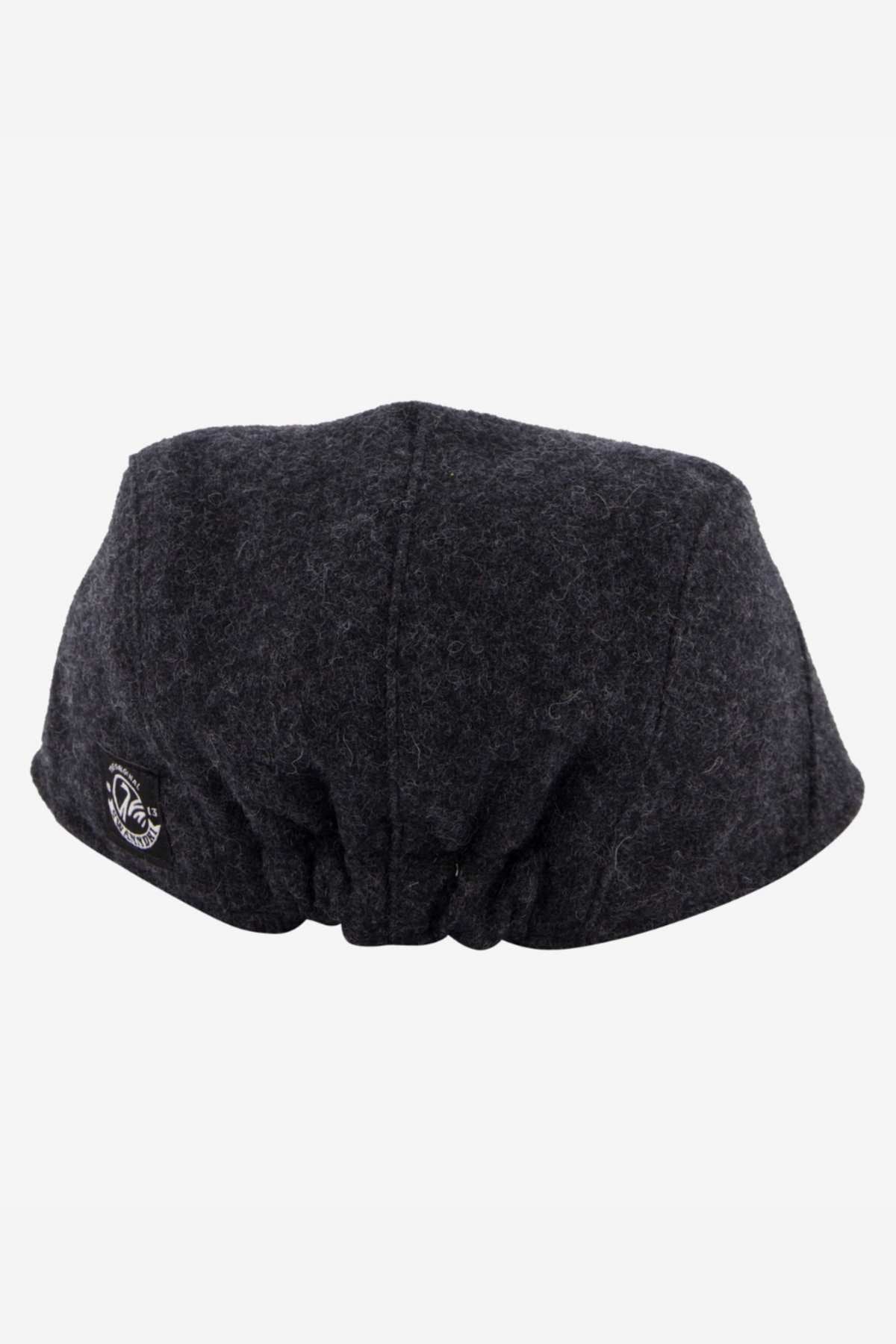 The dark gray wool-blend beret, with stitching details and a logo tag, has a gathered back section for texture. It's ideal for outdoor adventures or accentuating your Swanndri Bristol Flat Cap collection with its simple, elegant style.