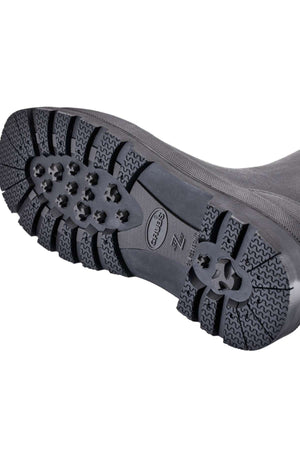 Close-up view of the sole of a Grubs Fenline High Work Boot, featuring deep treads and protruding cleats for superior grip. The brand name "Grubs" and other markings are visible on the neoprene sole. The background is white.