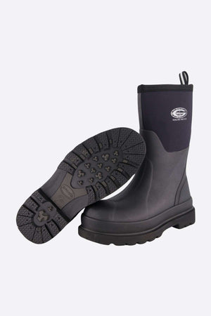 Grubs Fenline Mid Work Boot featuring thick black rubber soles and an ankle-high design. One boot is upright while the other lies on its side, displaying a tread pattern for superior grip. A logo is visible on the upright boot's side, ensuring maximum safety in every step.