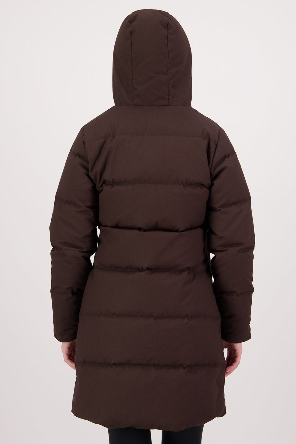 A person is seen from behind wearing the Swanndri Nimbus Longline Down Coat with a hood, arms at their sides, standing against a plain light background.